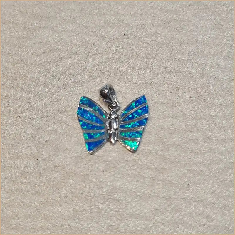Pendentif papillon opaline bleue "PO205.B"