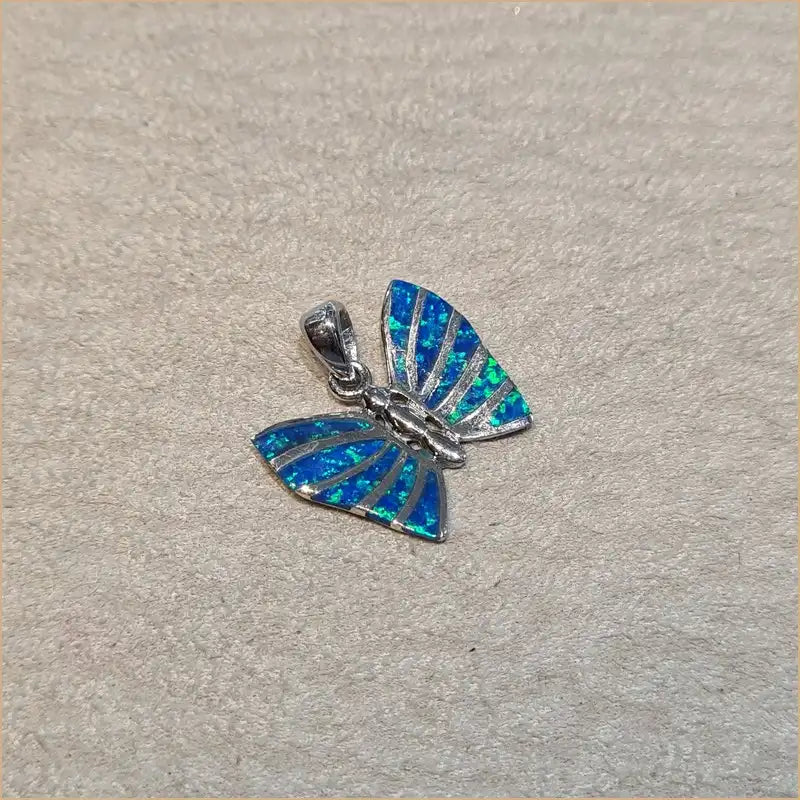 Pendentif papillon opaline bleue "PO205.B"