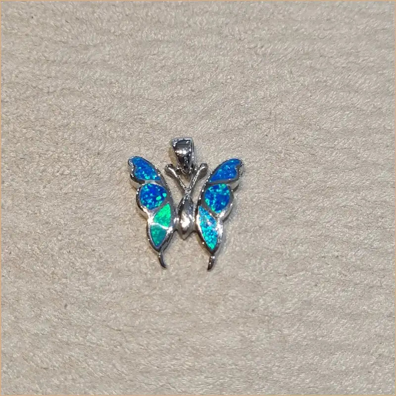 Pendentif papillon opaline bleue "PO208.B"