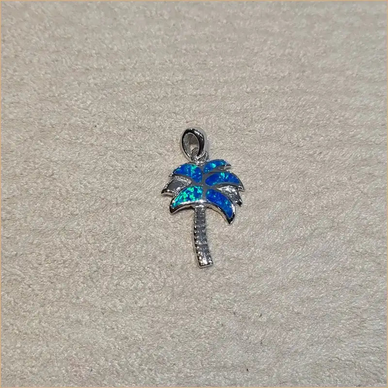 Pendentif palmier opaline bleue "PO209.B"