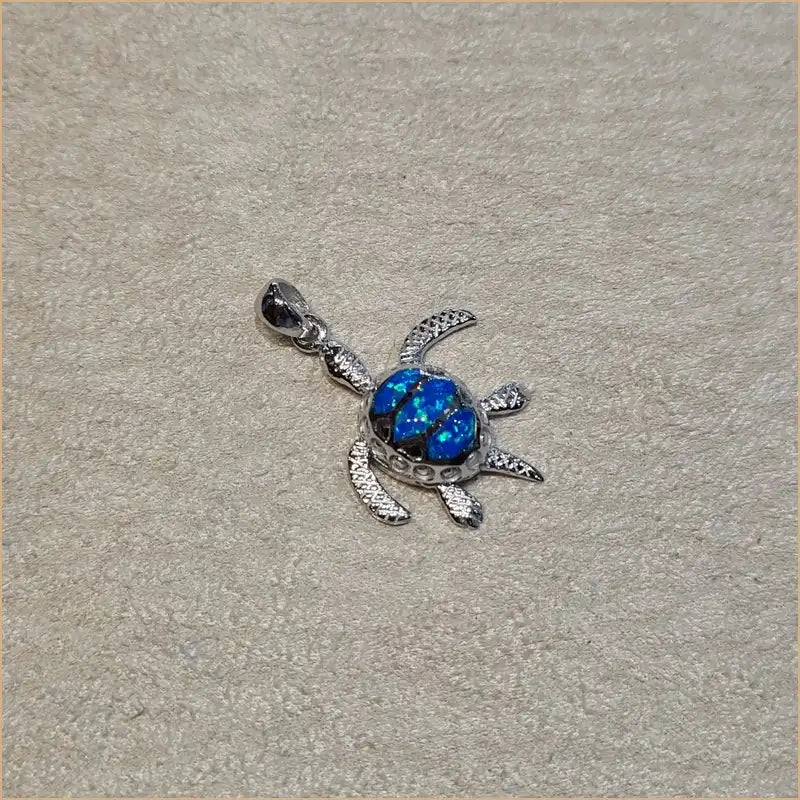 Pendentif tortue opaline bleue "POT24.B"