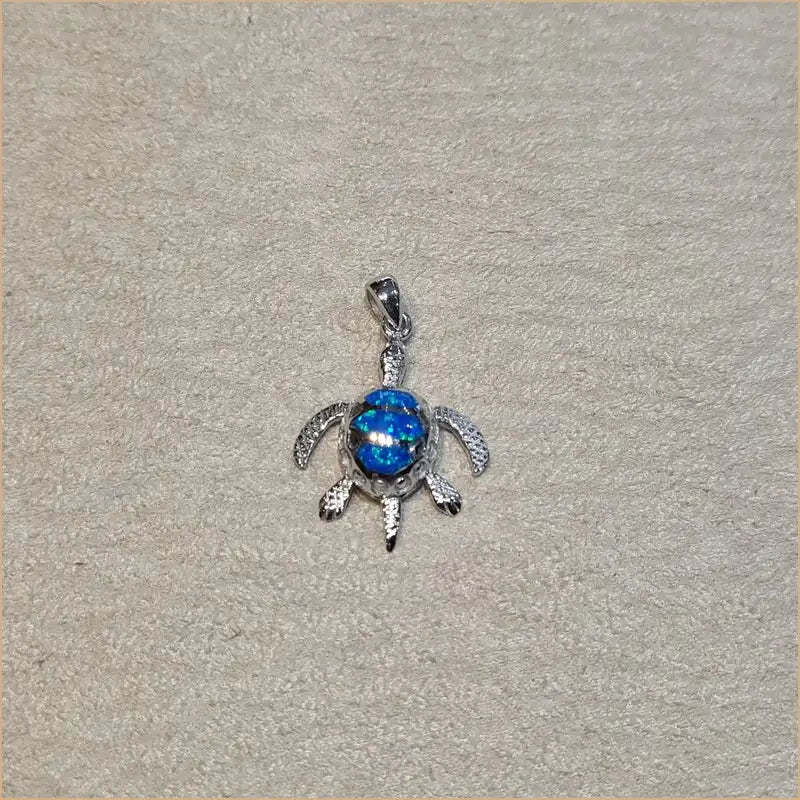 Pendentif tortue opaline bleue "POT24.B"