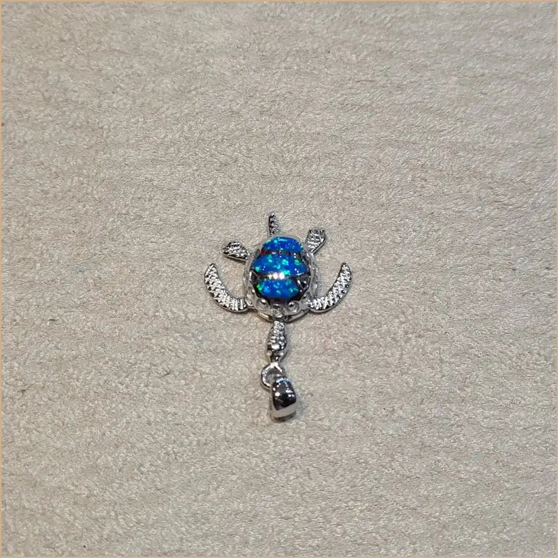 Pendentif tortue opaline bleue "POT24.B"