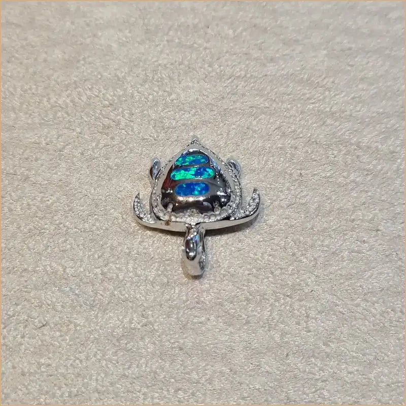 Pendentif tortue opaline bleue "POT32.B"