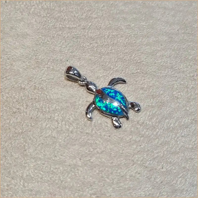 Pendentif tortue opaline bleue "POT36.B"