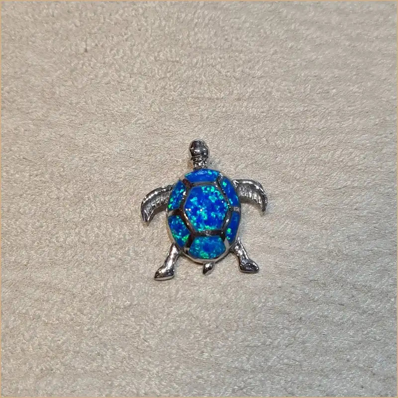 Pendentif tortue en argent 925 et opaline bleue vue du dessus POT40