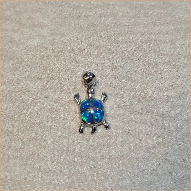 Pendentif tortue opaline bleue "POT42.B"