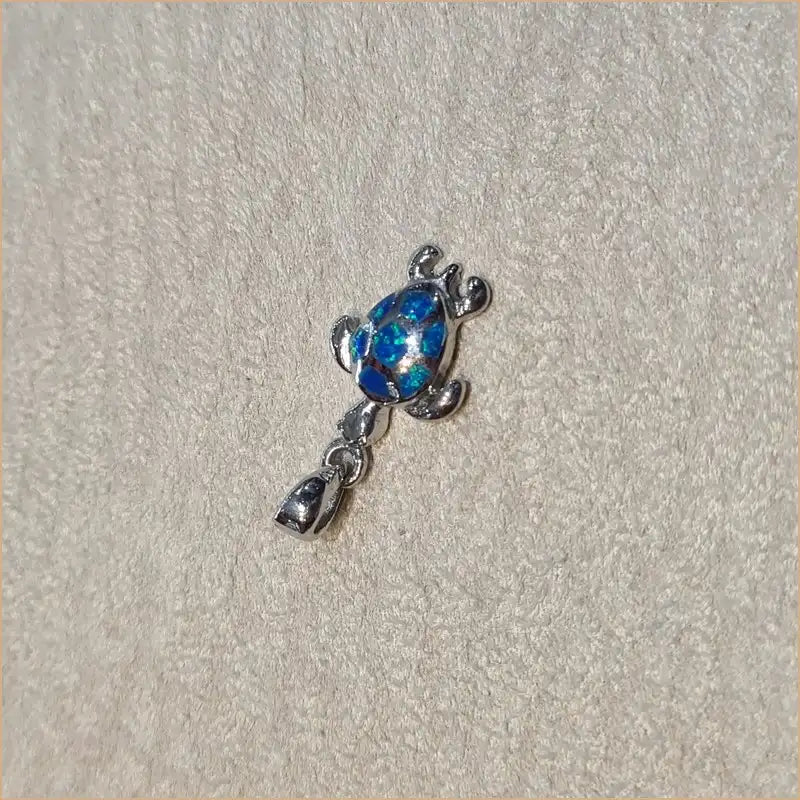 Pendentif tortue opaline bleue "POT44.B"