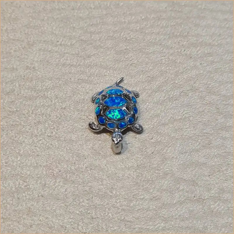Pendentif tortue opaline bleue "POT45.B"