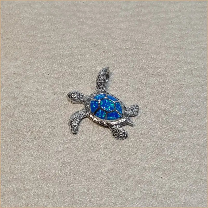 Pendentif tortue opaline bleue "POT47.B"