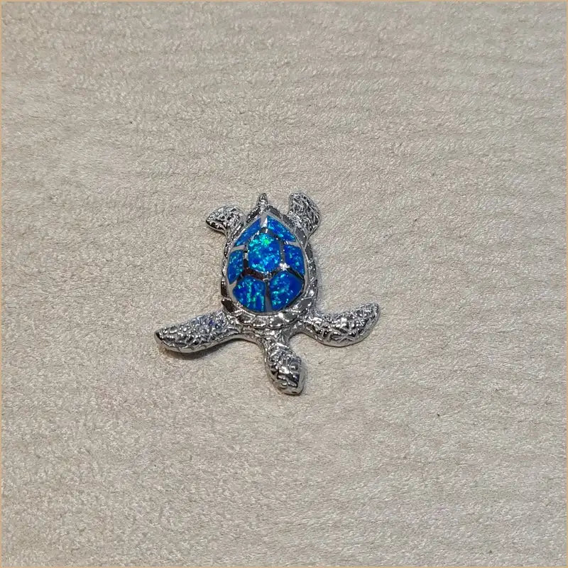 Pendentif tortue opaline bleue "POT47.B"
